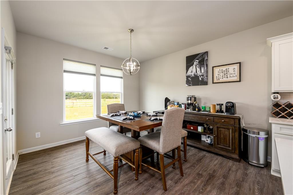 3741 Highway 83 Good Hope, GA 30641 - Photo 18 of 60 a view of a dining room with furniture window and wooden floor
