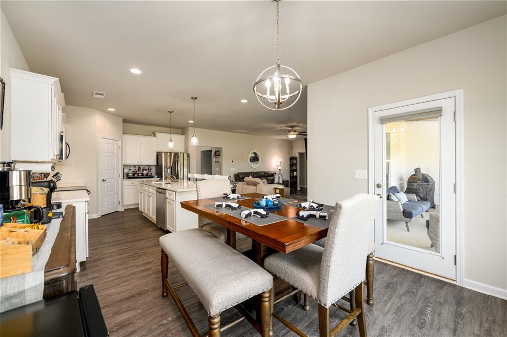 3741 Highway 83 Good Hope, GA 30641 - Photo 19 of 60 a living room with lots of furniture kitchen view and a chandelier