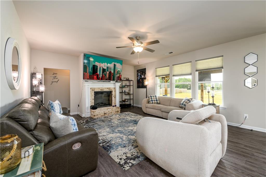 3741 Highway 83 Good Hope, GA 30641 - Photo 22 of 60 a living room with furniture a fireplace and a large window