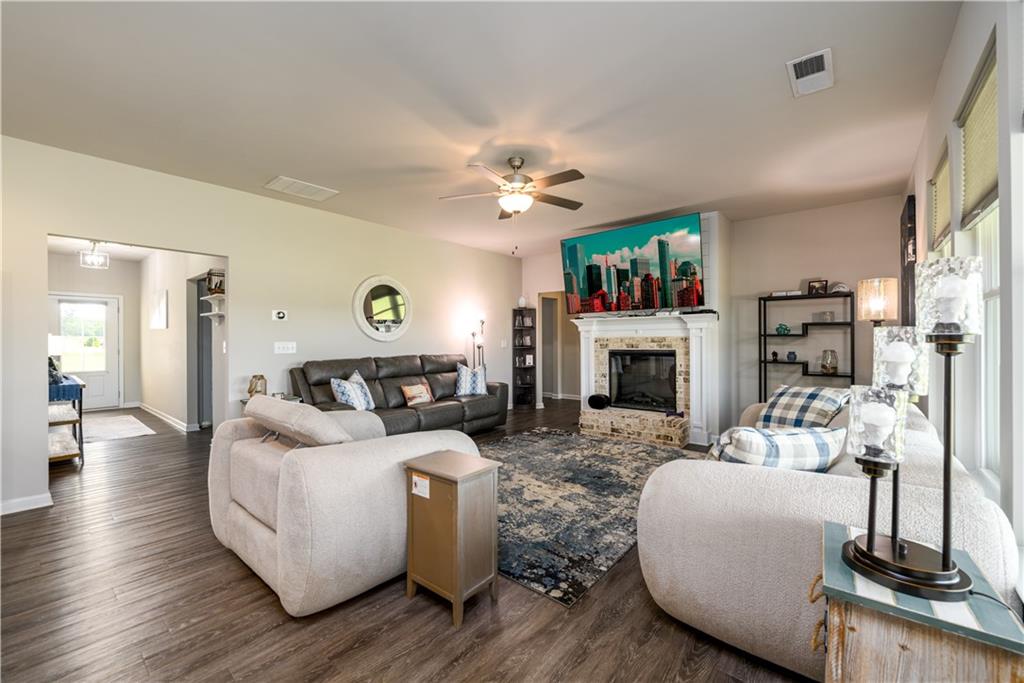 3741 Highway 83 Good Hope, GA 30641 - Photo 23 of 60 a living room with furniture a fireplace and a flat screen tv