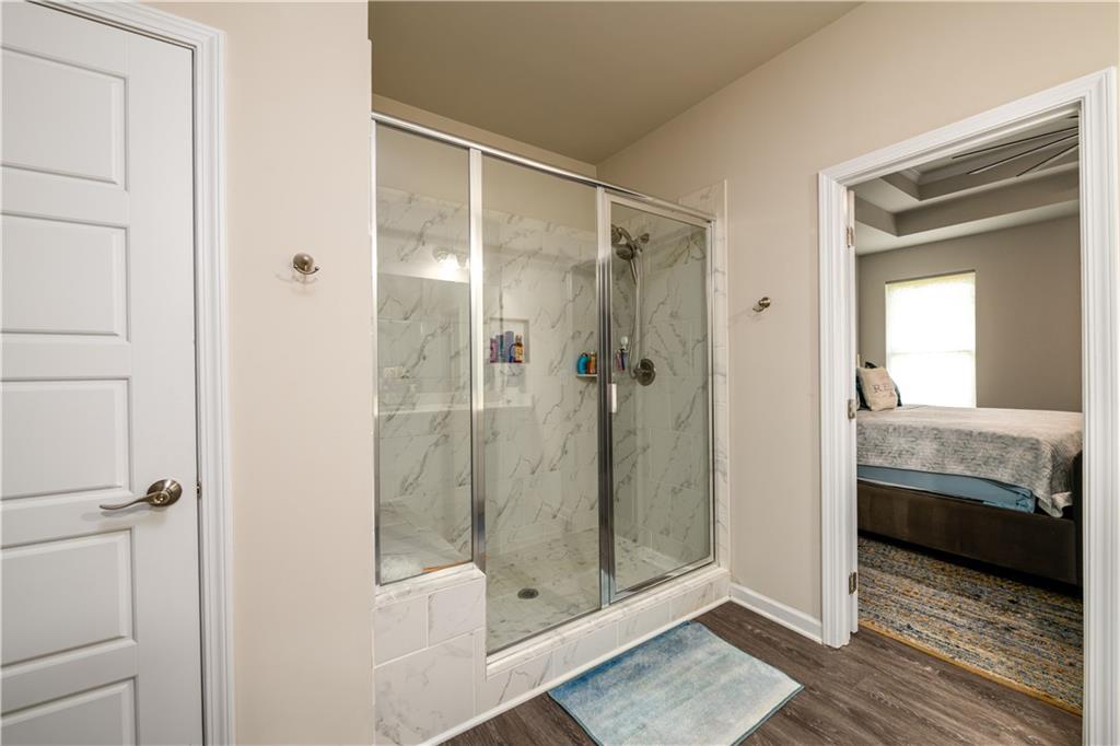 3741 Highway 83 Good Hope, GA 30641 - Photo 28 of 60 a bathroom with a glass door shower