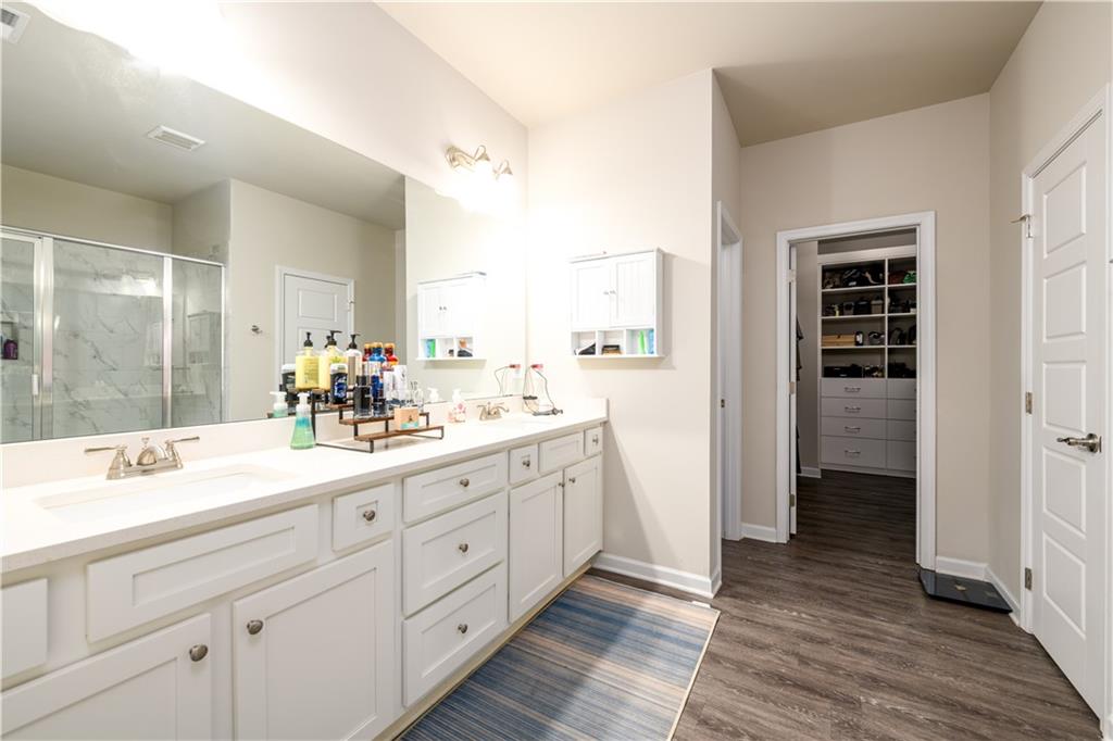 3741 Highway 83 Good Hope, GA 30641 - Photo 29 of 60 a bathroom with a double vanity sink and a mirror