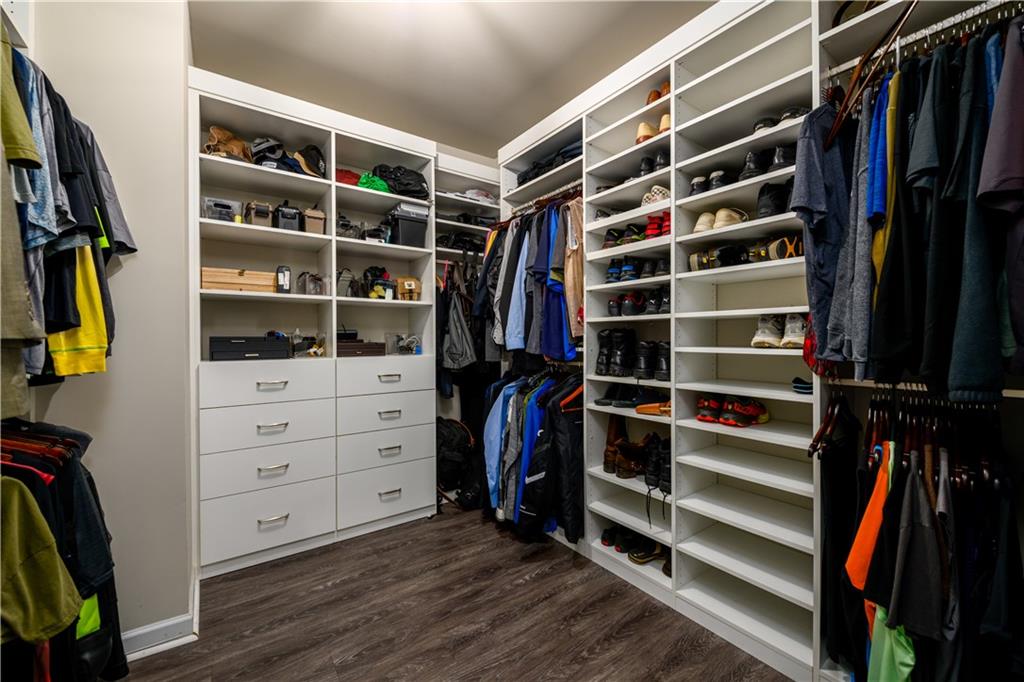 3741 Highway 83 Good Hope, GA 30641 - Photo 30 of 60 a view of walk in closet with clothes and shoes
