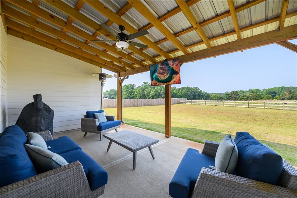 3741 Highway 83 Good Hope, GA 30641 - Photo 36 of 60 a living room with furniture and a floor to ceiling window