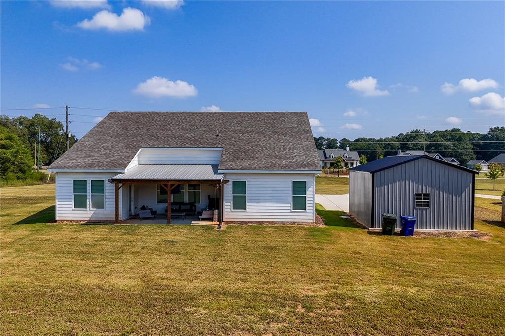 3741 Highway 83 Good Hope, GA 30641 - Photo 49 of 60 a front view of house with yard and trees in the background