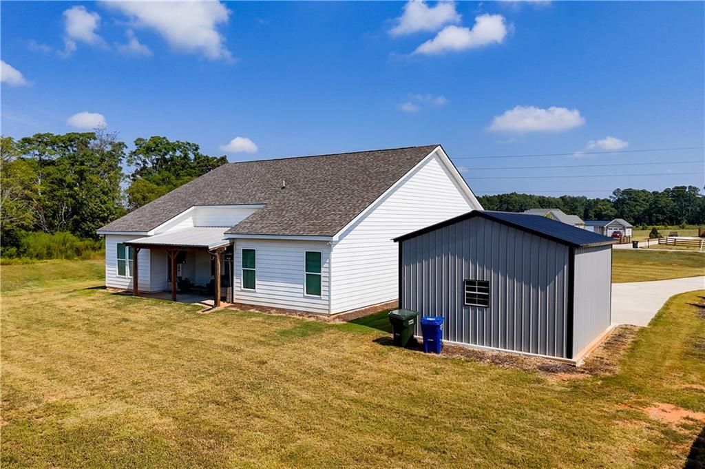 3741 Highway 83 Good Hope, GA 30641 - Photo 50 of 60 a view of house with yard and garage