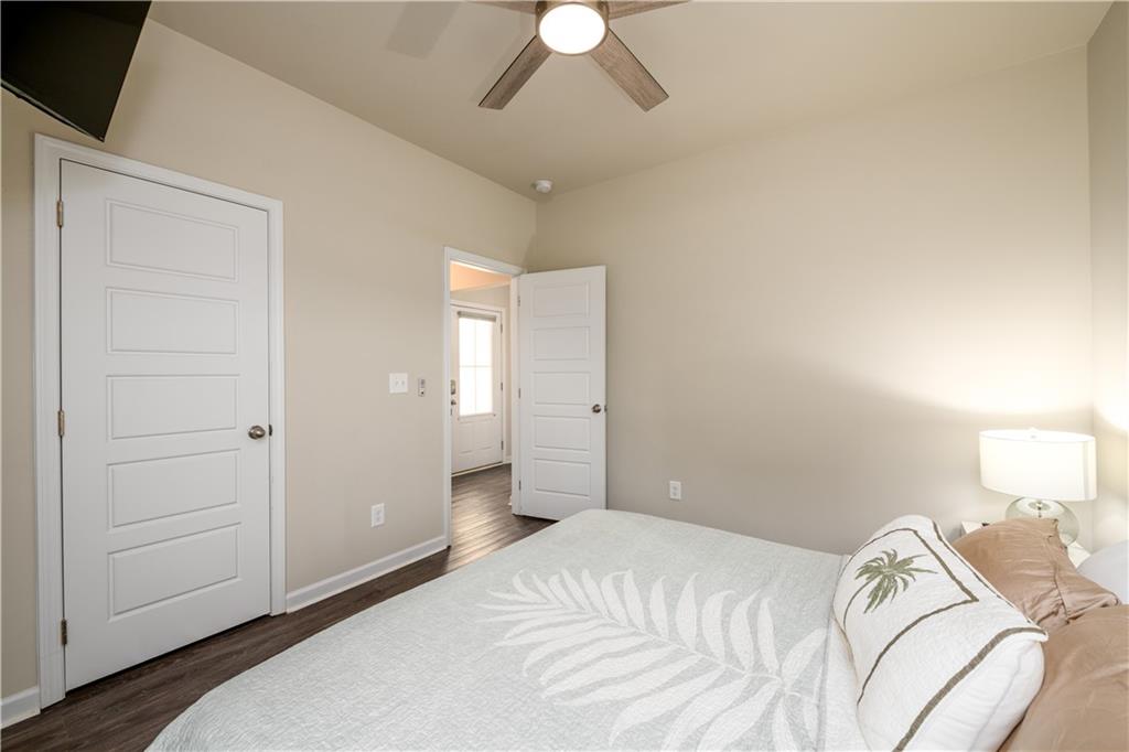 3741 Highway 83 Good Hope, GA 30641 - Photo 8 of 60 a bedroom with a bed and a chandelier