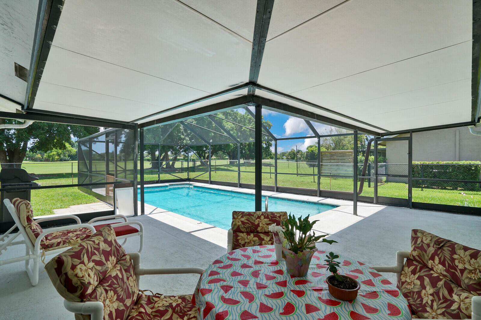 19620 Hampton Drive Boca Raton, FL 33434 - Photo 36 of 45 a view of a porch with furniture and garden