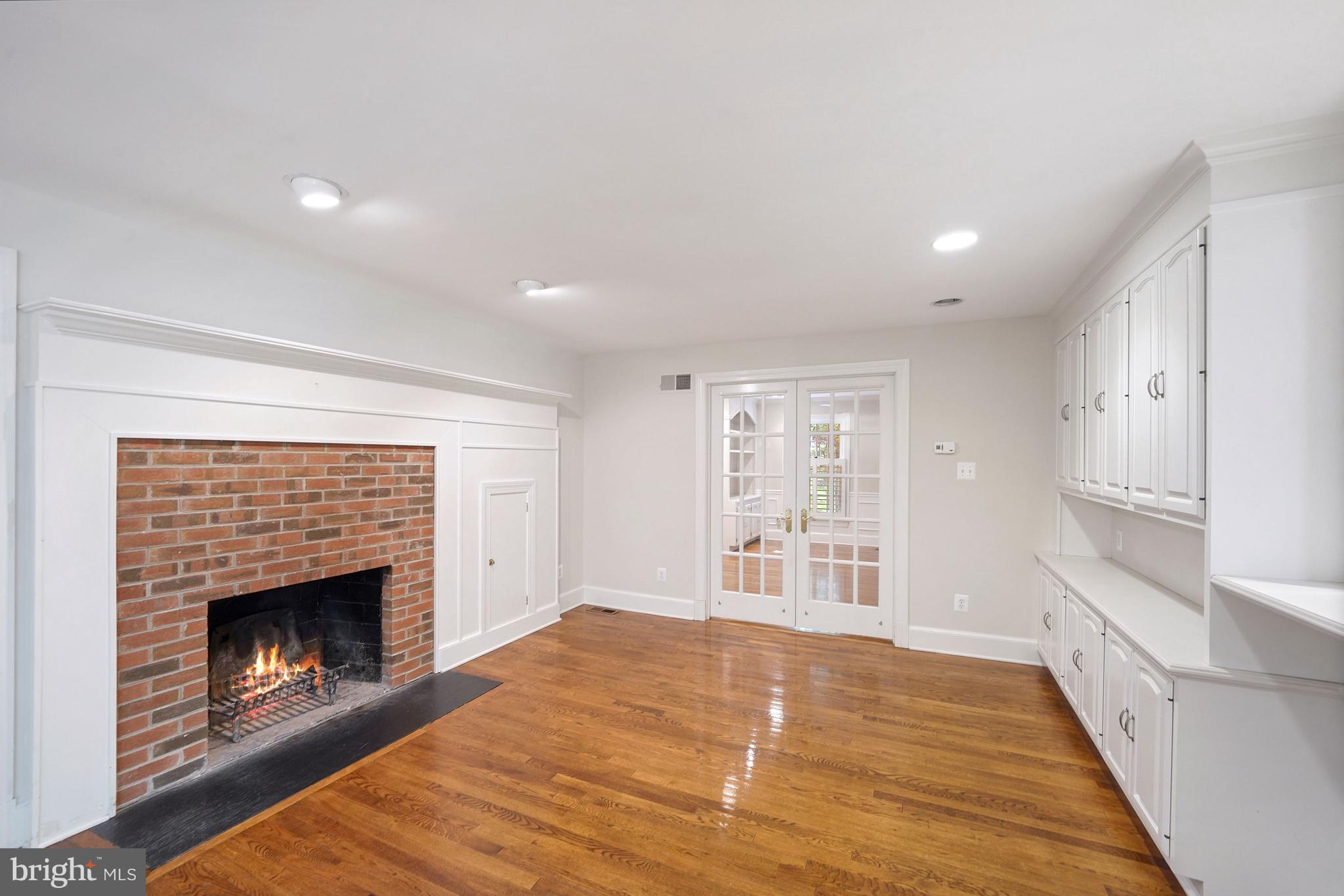 1226 Aldebaran Drive McLean, VA 22101 - Photo 15 of 40 a view of an empty room with a fireplace and a window