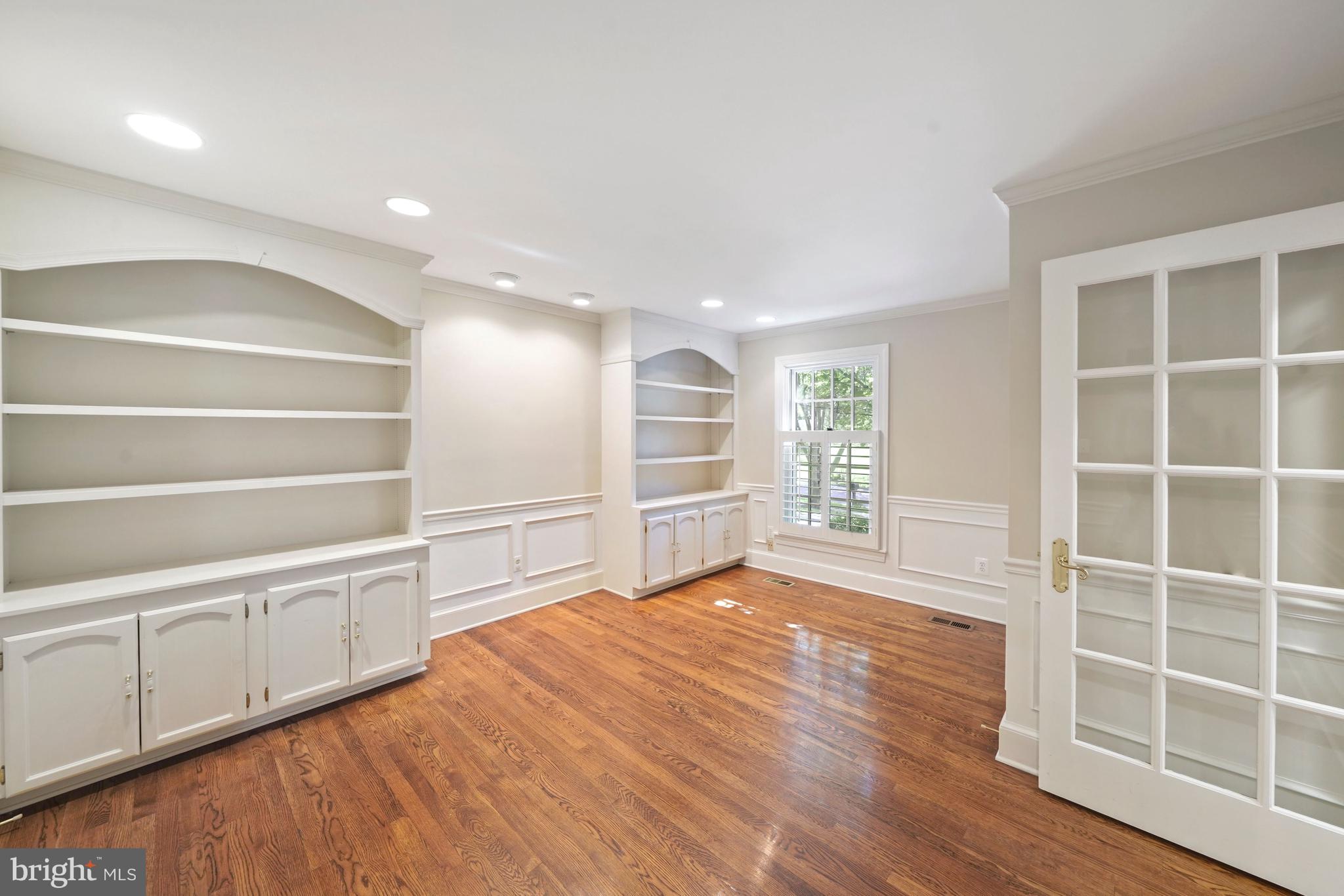 1226 Aldebaran Drive McLean, VA 22101 - Photo 16 of 40 a view of an empty room with wooden floor and windows