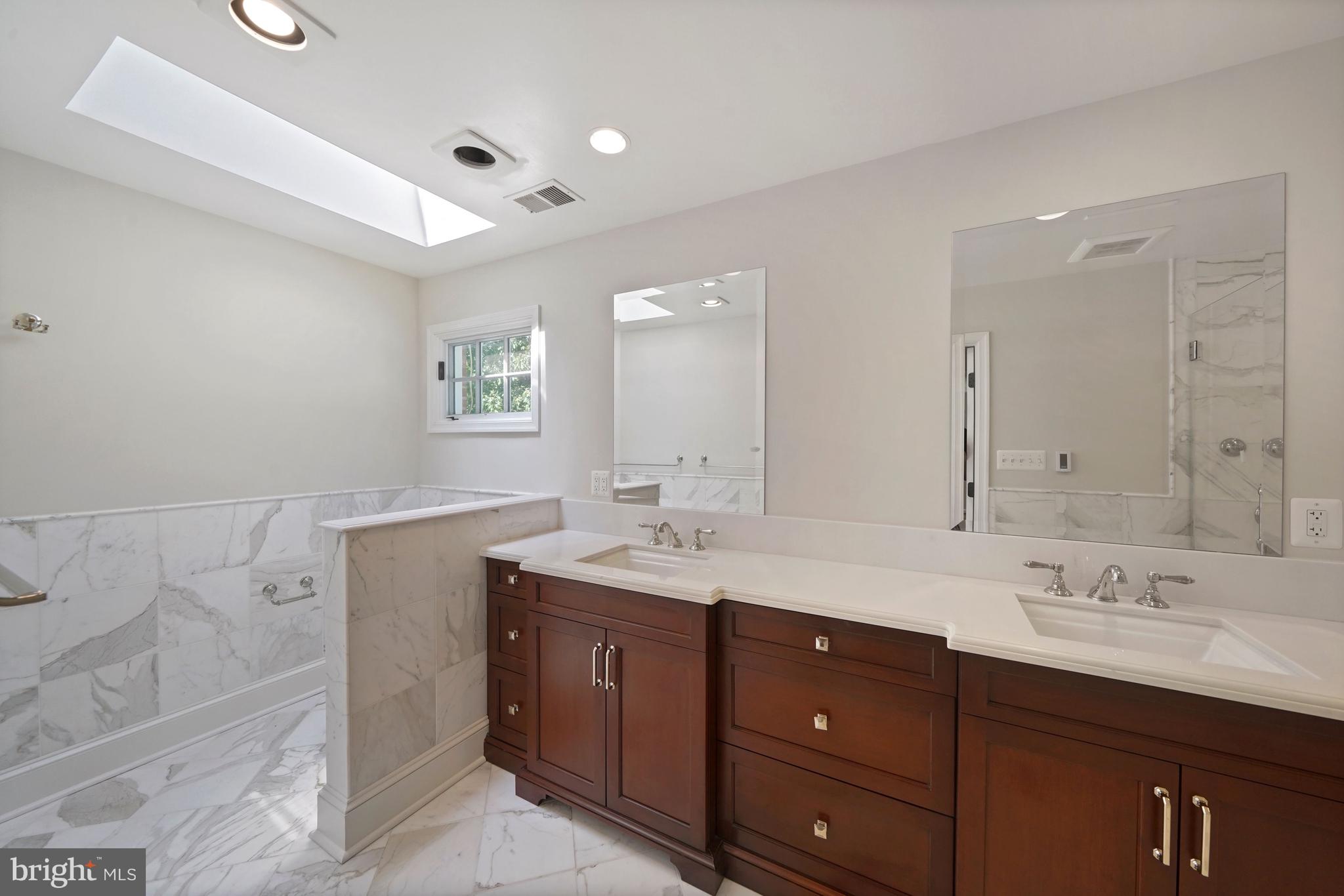 1226 Aldebaran Drive McLean, VA 22101 - Photo 21 of 40 a bathroom with a granite countertop sink mirror and double