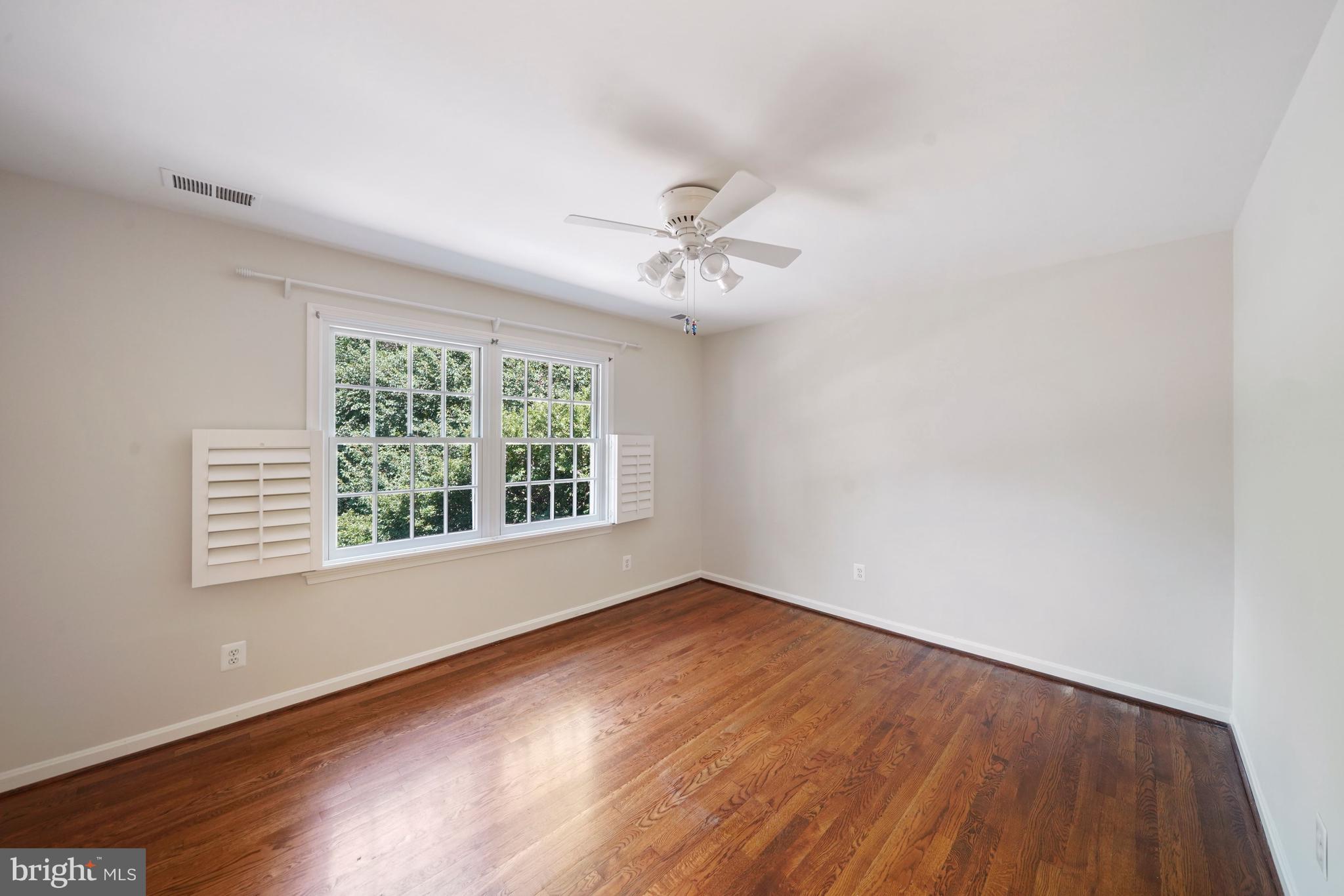 1226 Aldebaran Drive McLean, VA 22101 - Photo 25 of 40 wooden floor in an empty room with a window