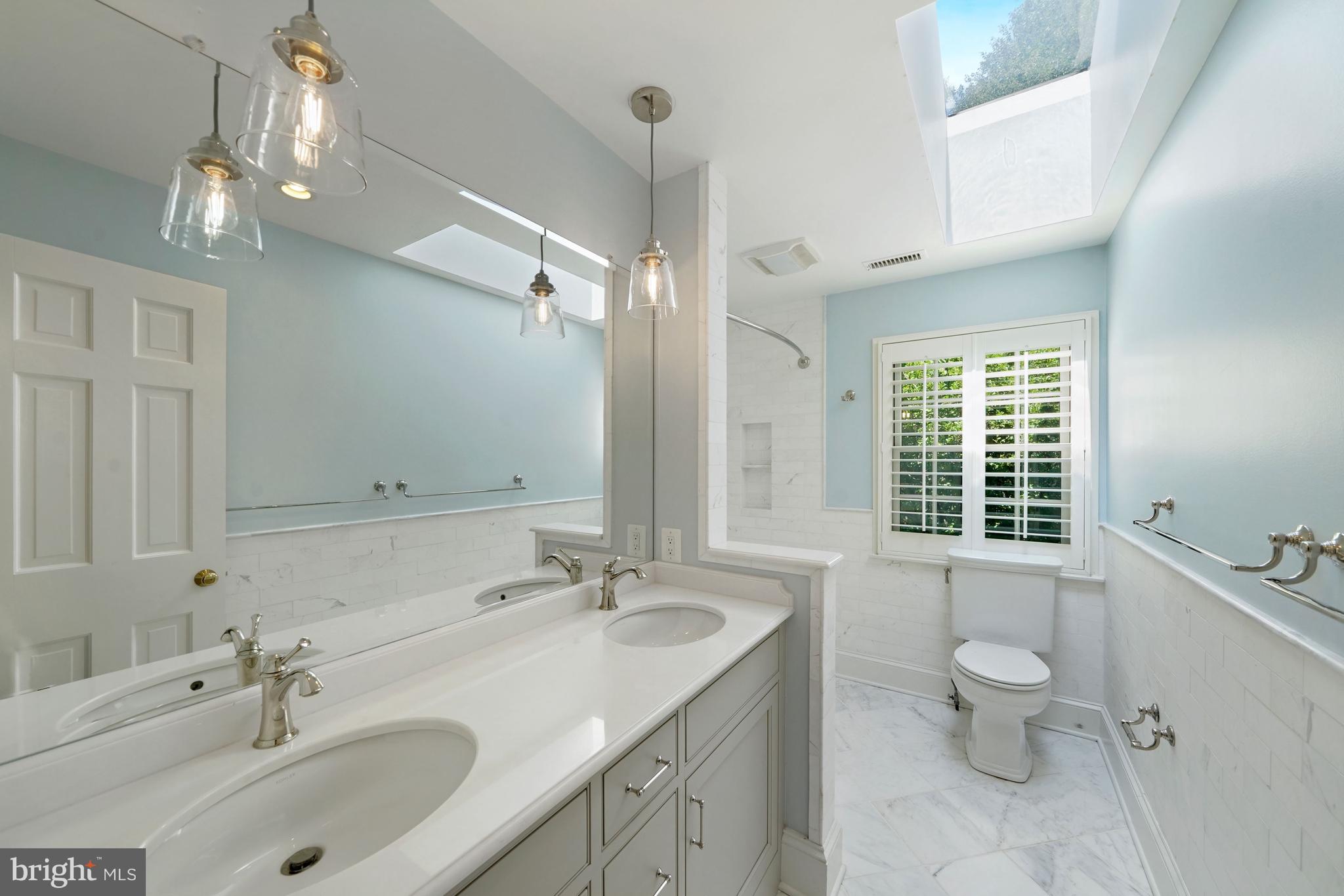 1226 Aldebaran Drive McLean, VA 22101 - Photo 26 of 40 a bathroom with a sink double vanity and a toilet