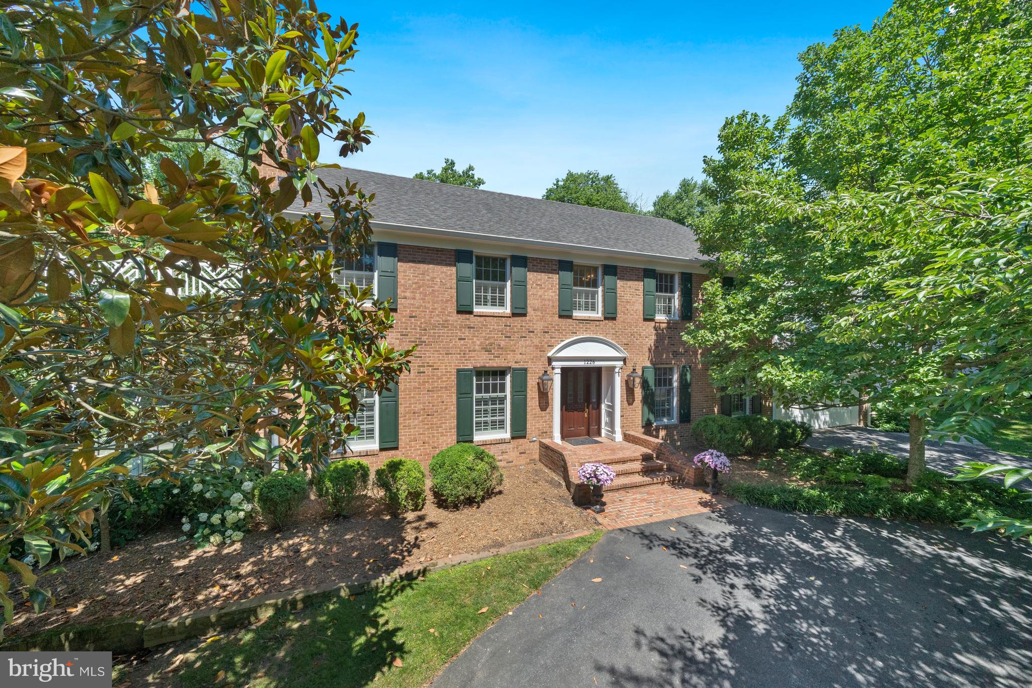 1226 Aldebaran Drive McLean, VA 22101 - Photo 3 of 40 a front view of a house with yard and green space