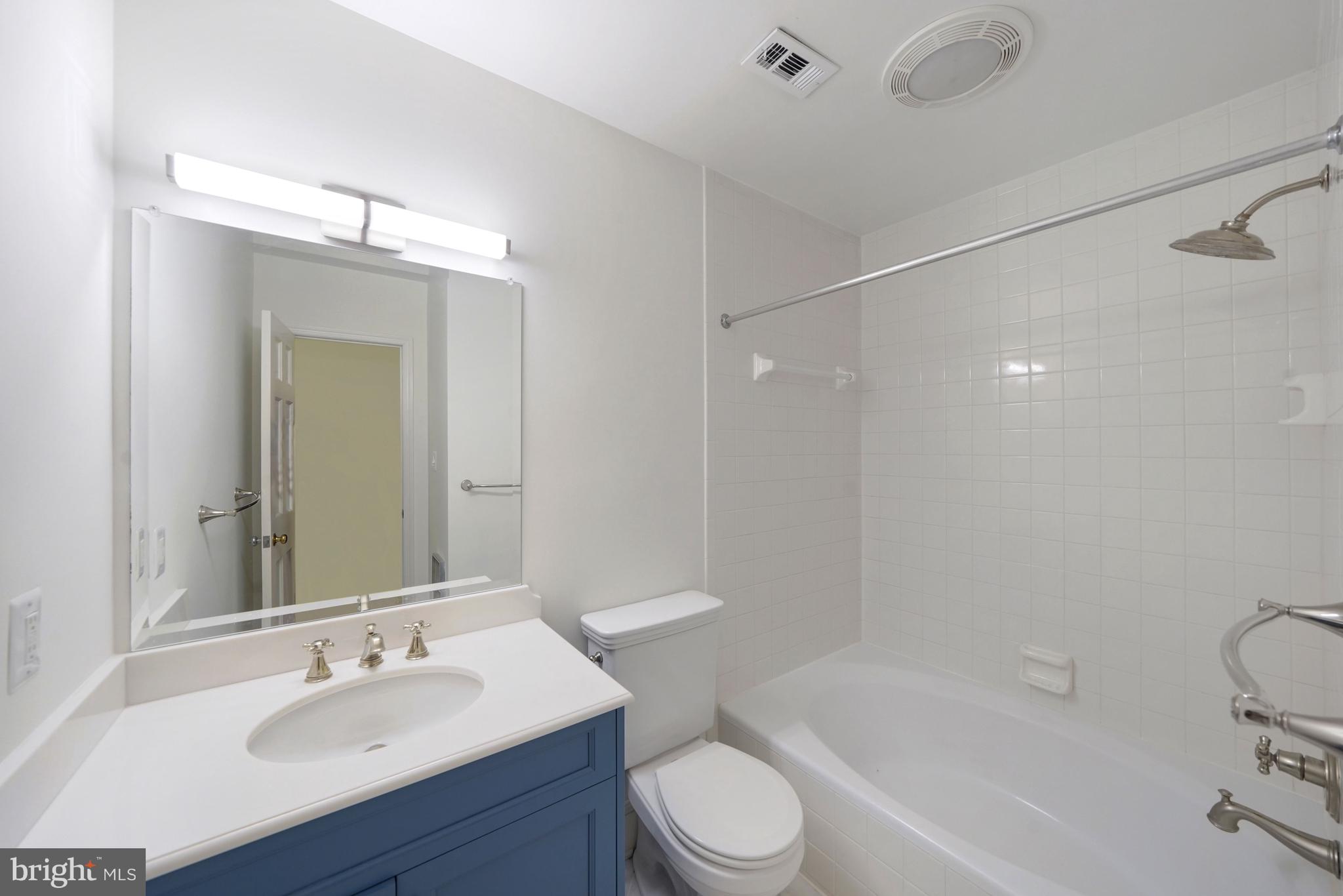 1226 Aldebaran Drive McLean, VA 22101 - Photo 35 of 40 a bathroom with a sink a toilet and shower