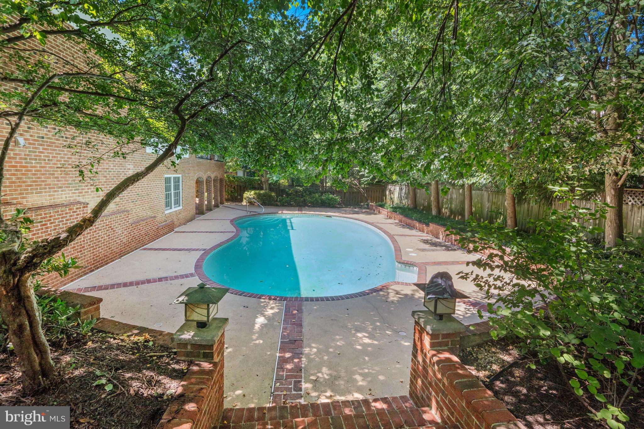 1226 Aldebaran Drive McLean, VA 22101 - Photo 37 of 40 a view of a swimming pool with a patio and outdoor seating