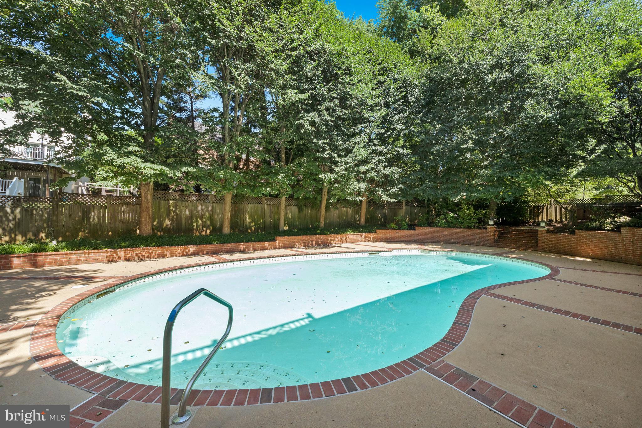 1226 Aldebaran Drive McLean, VA 22101 - Photo 38 of 40 a view of a swimming pool with a patio and yard