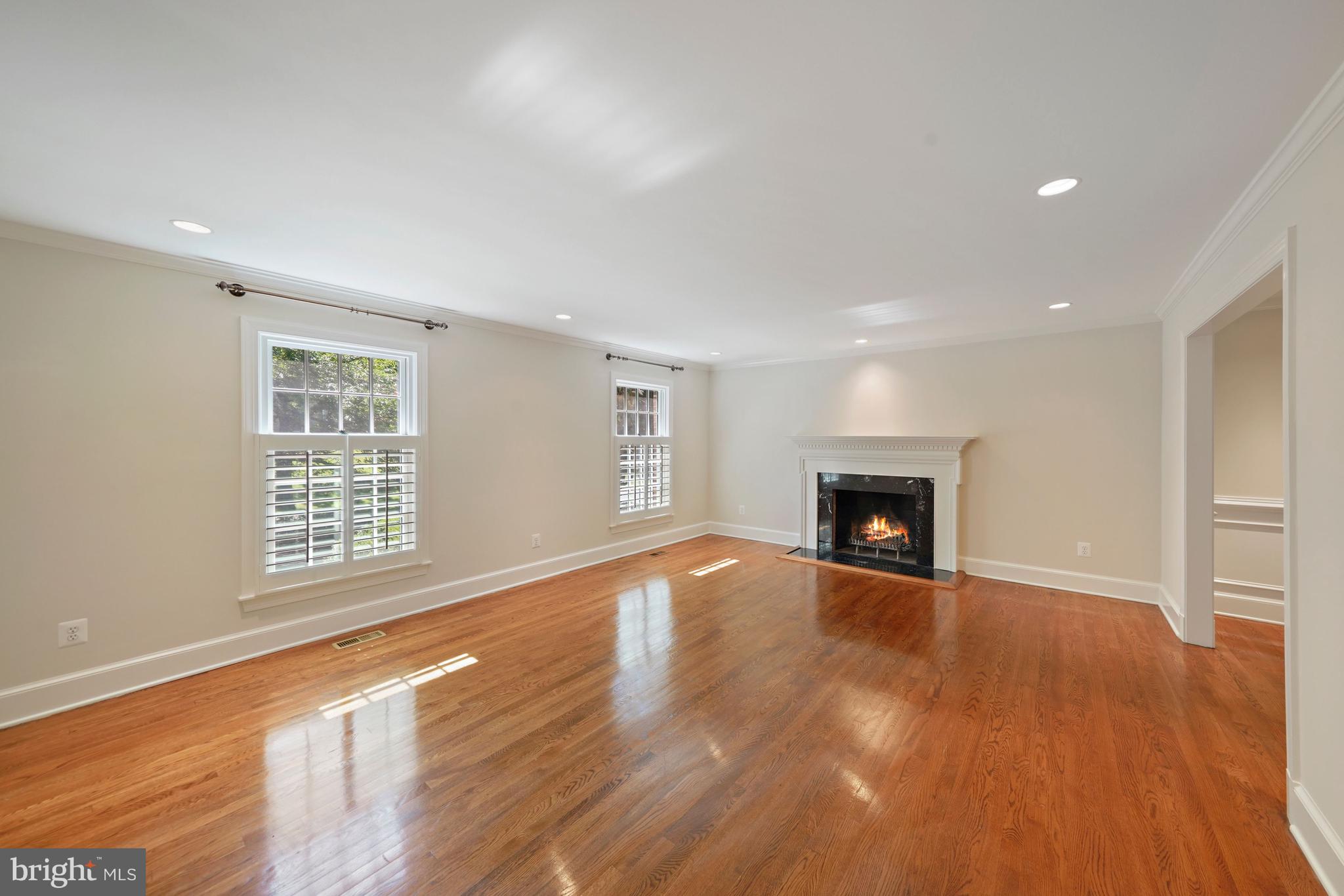 1226 Aldebaran Drive McLean, VA 22101 - Photo 6 of 40 a view of an empty room with a fireplace and a window