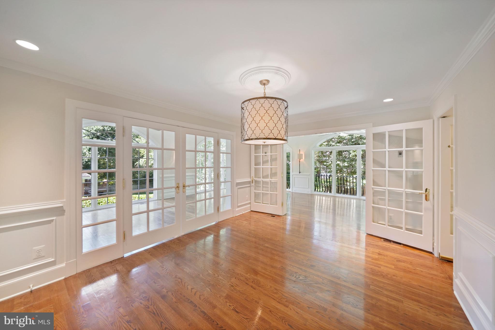 1226 Aldebaran Drive McLean, VA 22101 - Photo 7 of 40 a view of empty room with wooden floor and fan