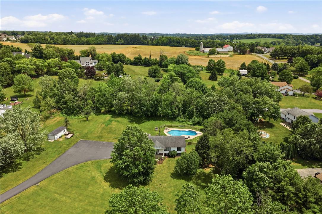 732 Bushkill Center Road Nazareth, PA 18064 - Photo 41 of 43 Vast, verdant grounds surround this charming home, boasting a refreshing pool and a scenic, sprawling rural backdrop.