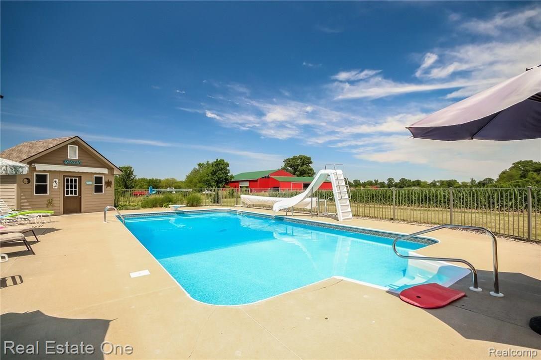 3550 Johnson Road Saline, MI 48176 - Photo 42 of 82 POOL HAS SLIDE,LADDER,EZ STEPS AND DIVING BOARD