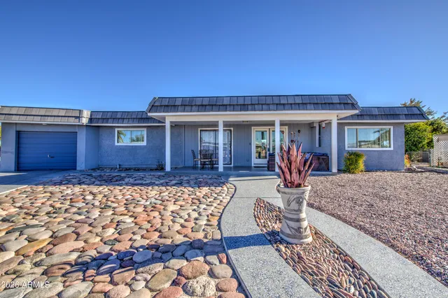 a front view of a house with garden