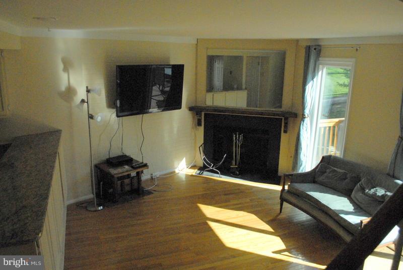2143 Whisper Way Reston, VA 20191 - Photo 9 of 30 Living Room w/ Fireplace