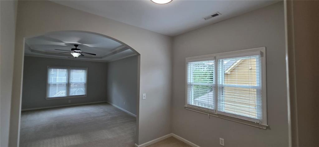 505 Wicklowe Place Acworth, GA 30102 - Photo 26 of 51 a view of a livingroom with a ceiling fan and window
