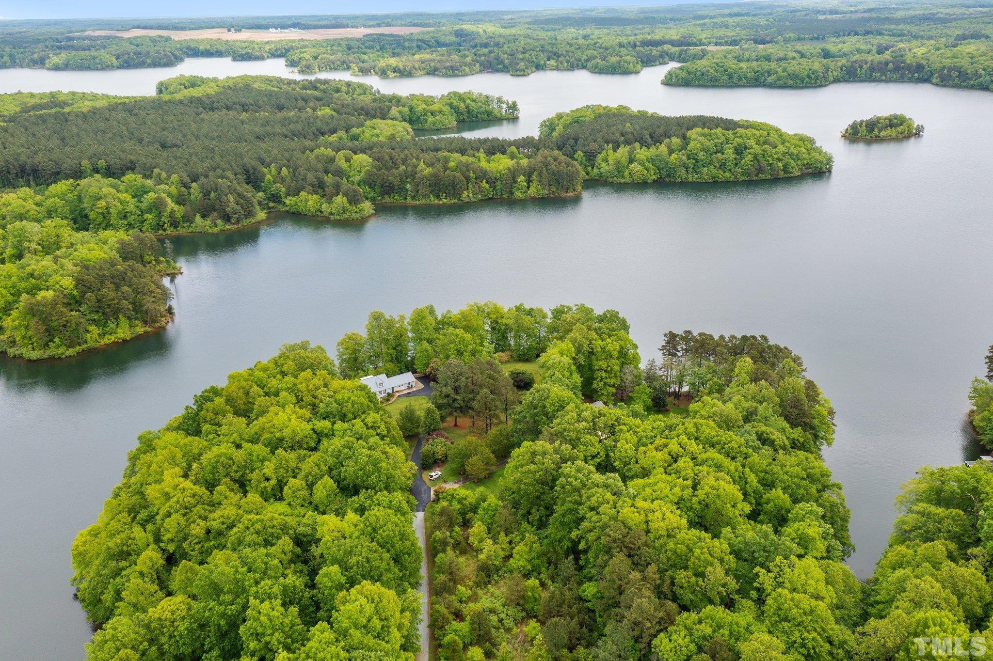 268 Dean Lane Roxboro, NC 27574 - Photo 16 of 38 an aerial view of a houses with outdoor space and lake view