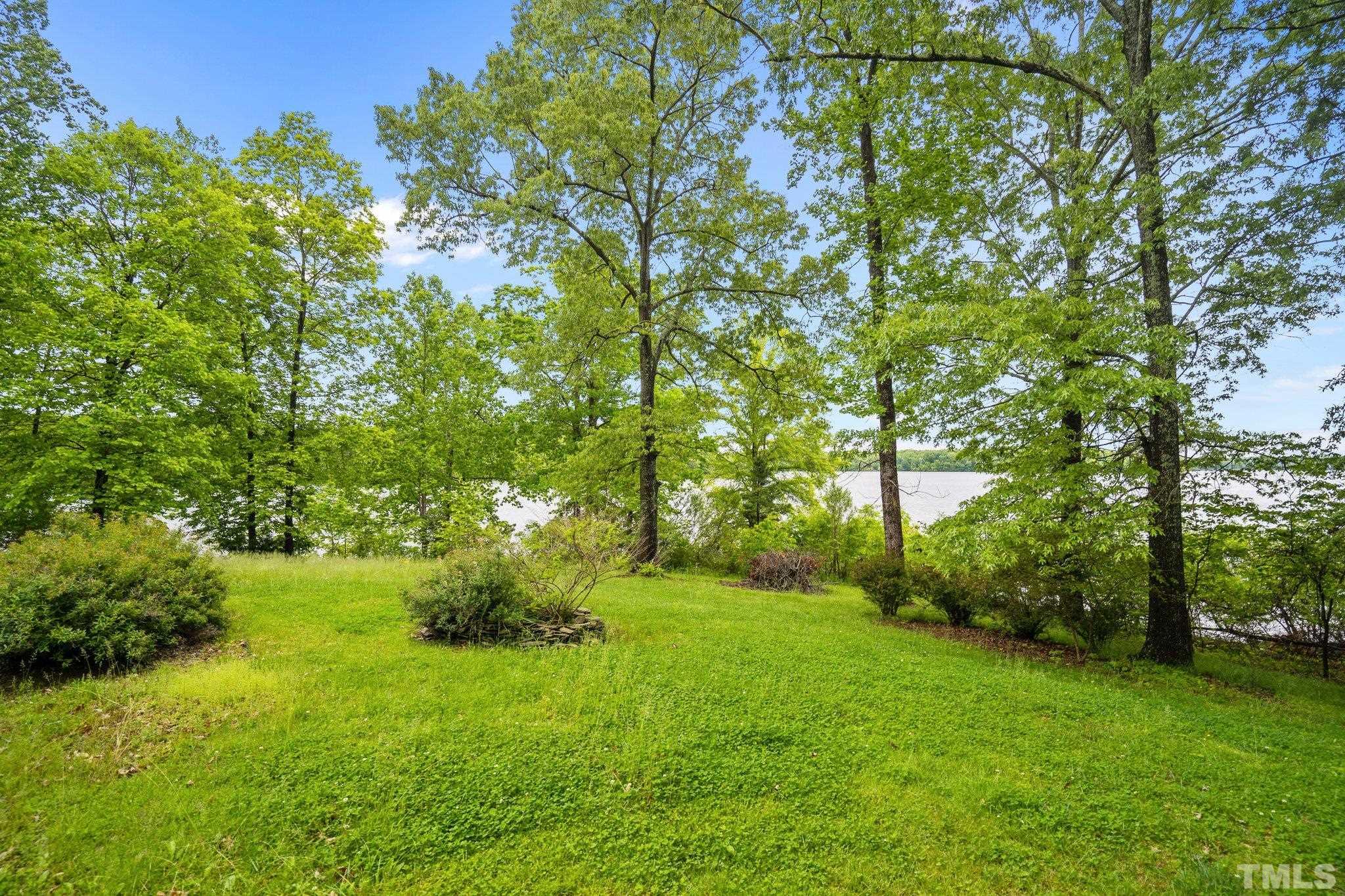 268 Dean Lane Roxboro, NC 27574 - Photo 2 of 38 a backyard of a house with lots of green space