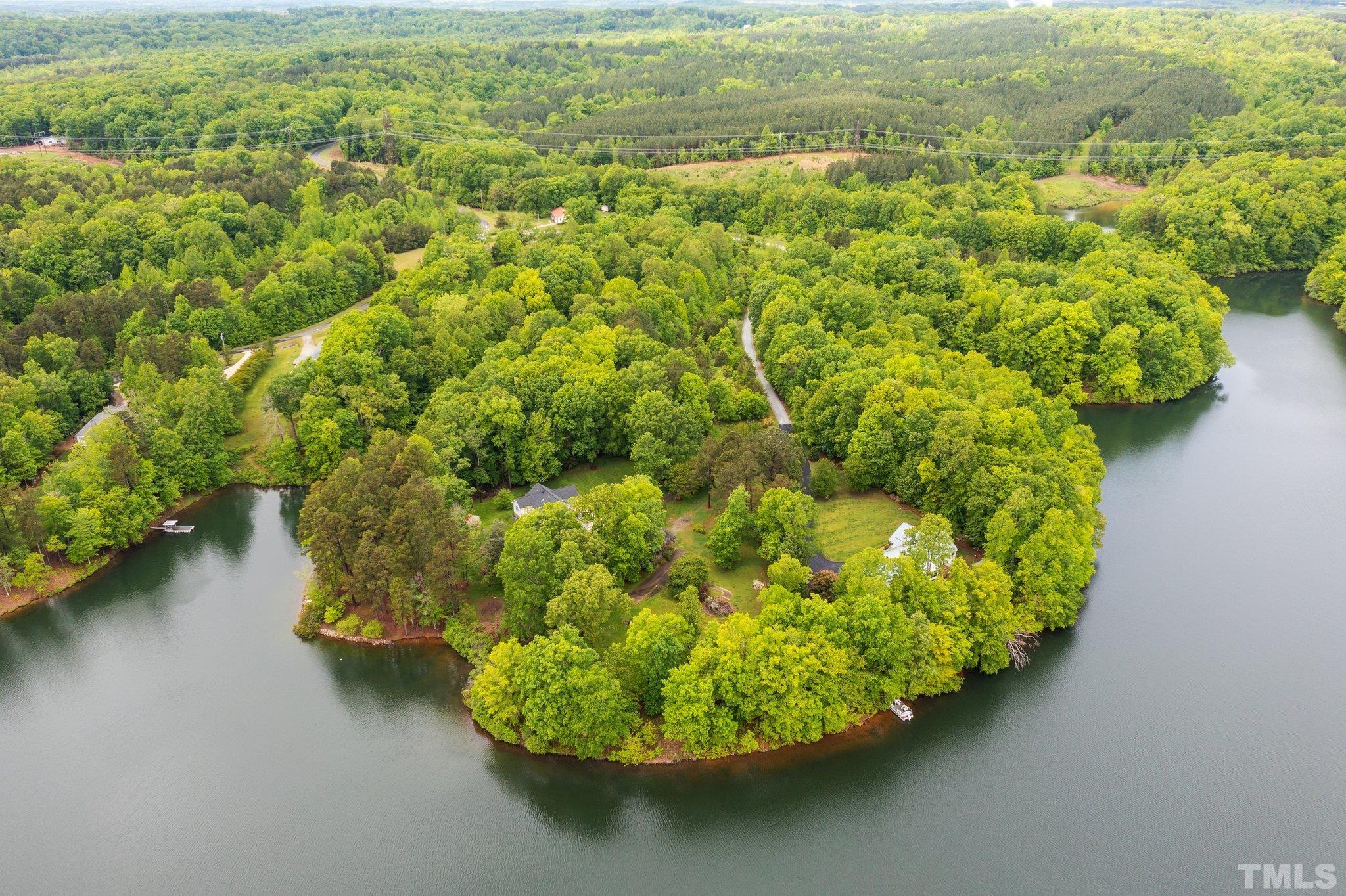 268 Dean Lane Roxboro, NC 27574 - Photo 23 of 38 a view of a lake with a yard
