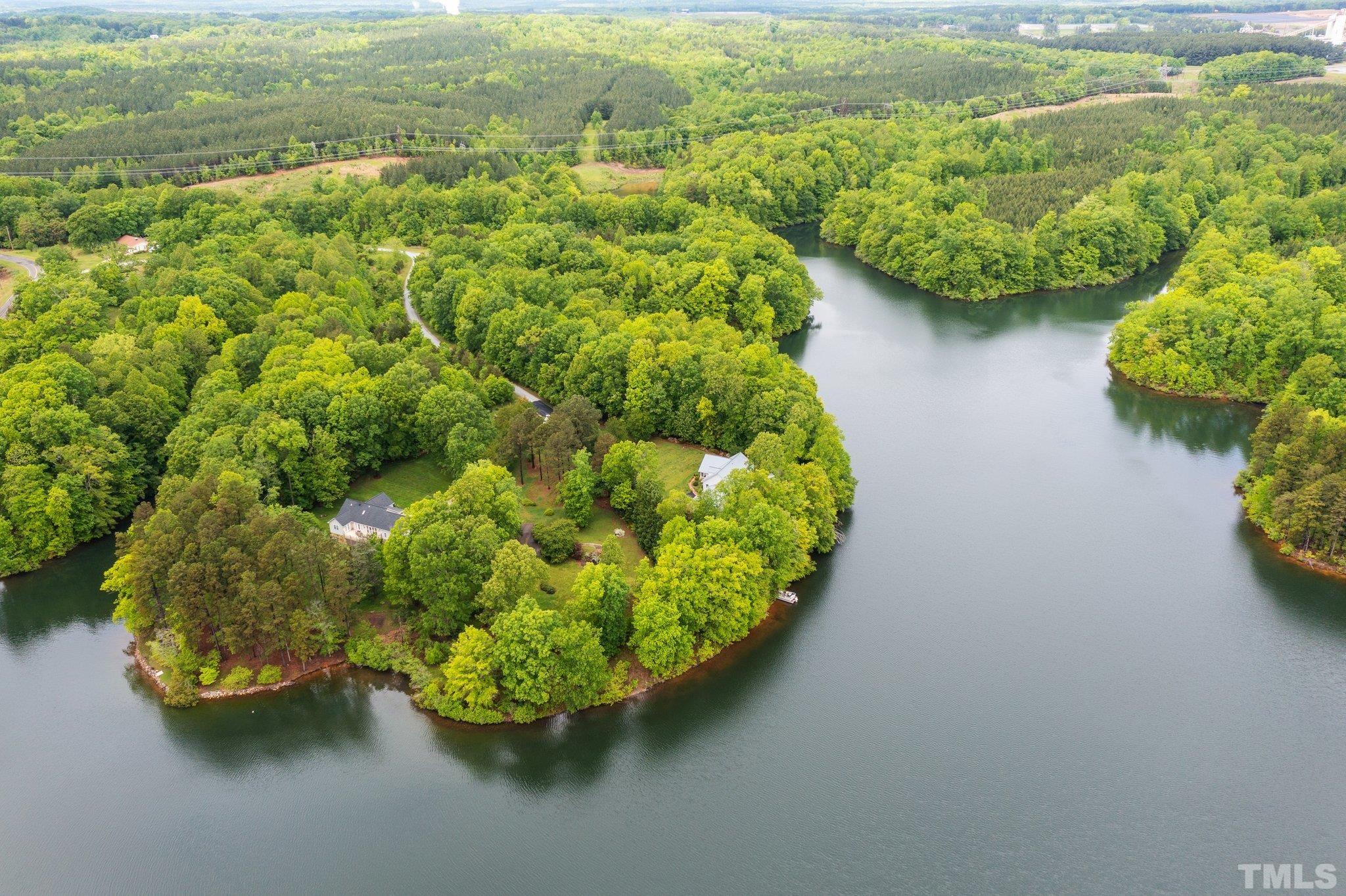 268 Dean Lane Roxboro, NC 27574 - Photo 24 of 38 an aerial view of a house with a yard and lake view