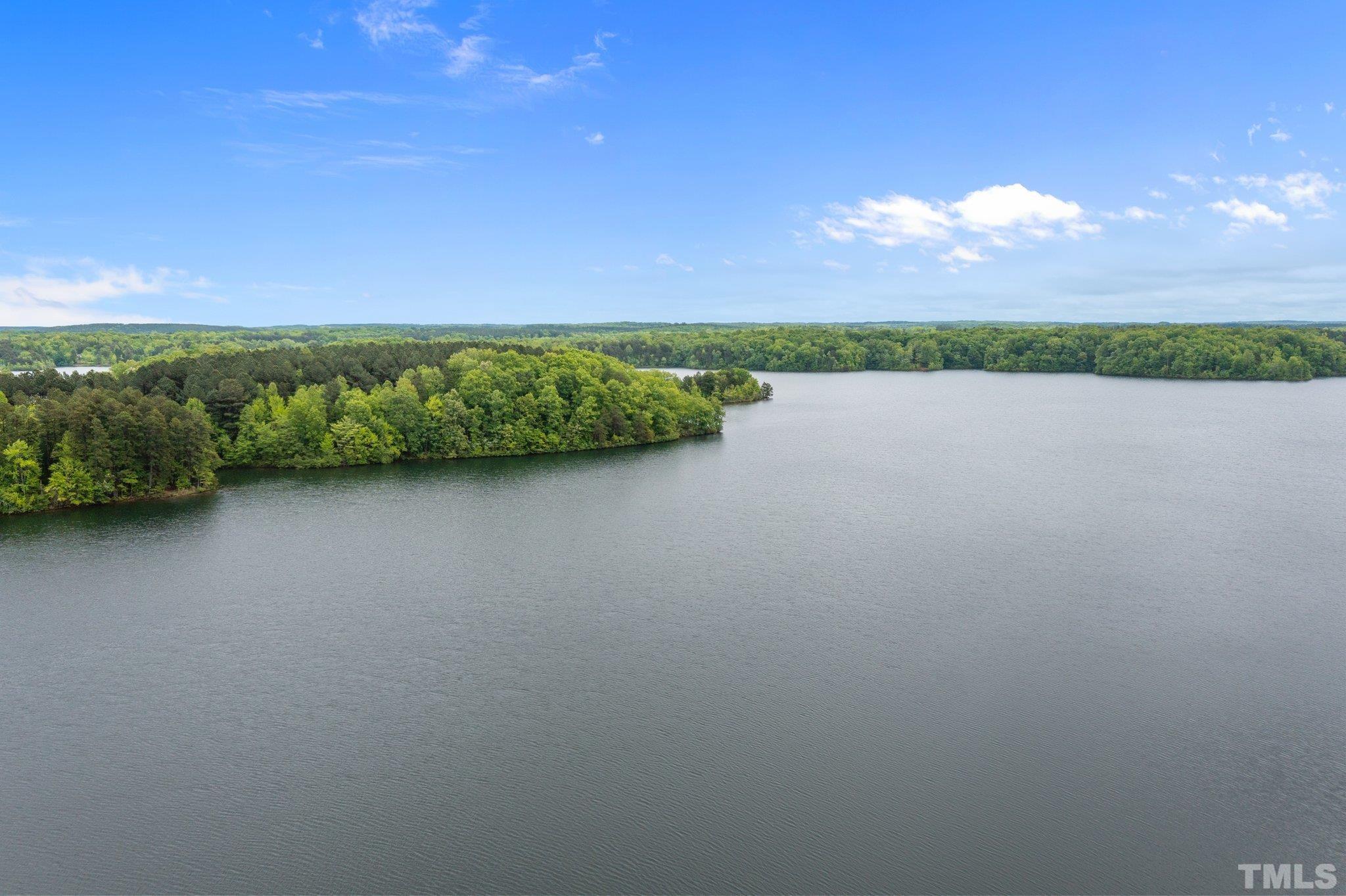 268 Dean Lane Roxboro, NC 27574 - Photo 27 of 38 a view of a lake with a city