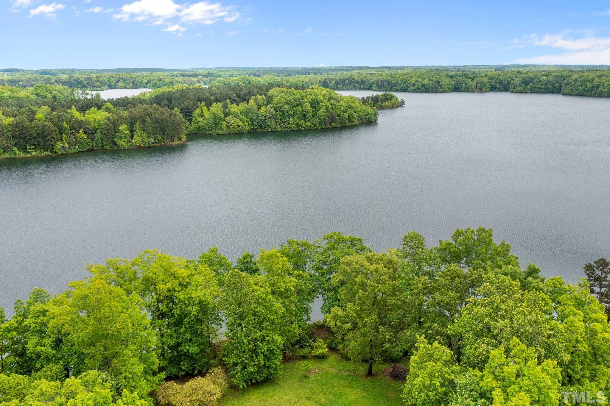 268 Dean Lane Roxboro, NC 27574 - Photo 28 of 38 a view of a lake with a mountain in the background