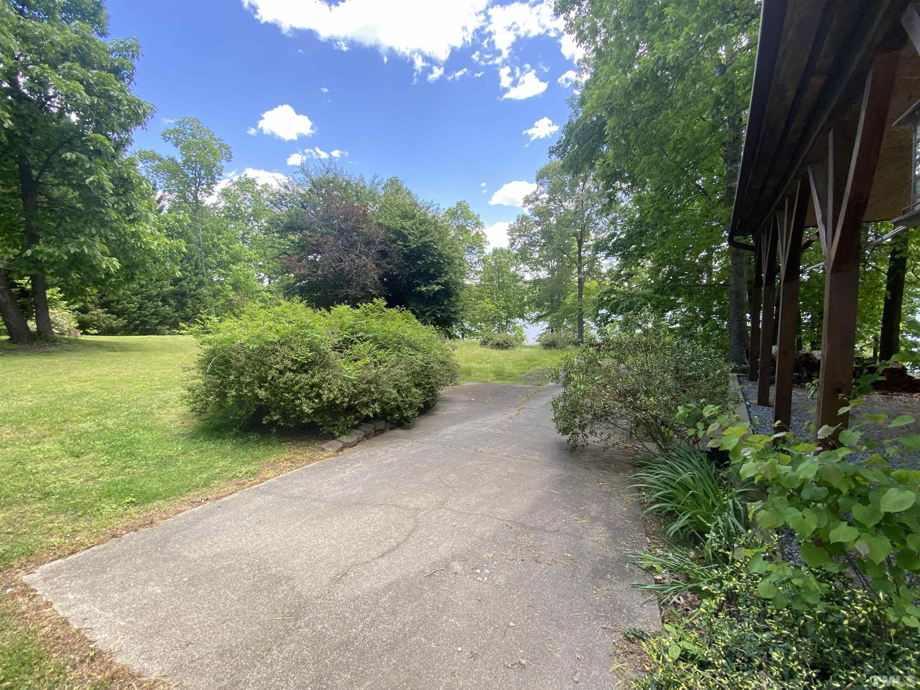 268 Dean Lane Roxboro, NC 27574 - Photo 32 of 38 a view of a garden with an trees