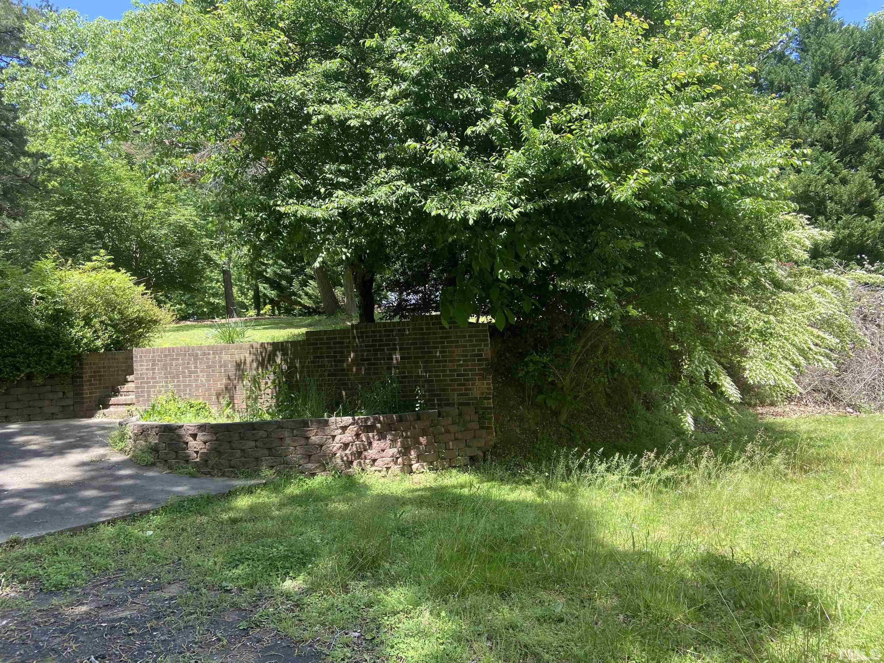 268 Dean Lane Roxboro, NC 27574 - Photo 37 of 38 a backyard of a house with lots of green space