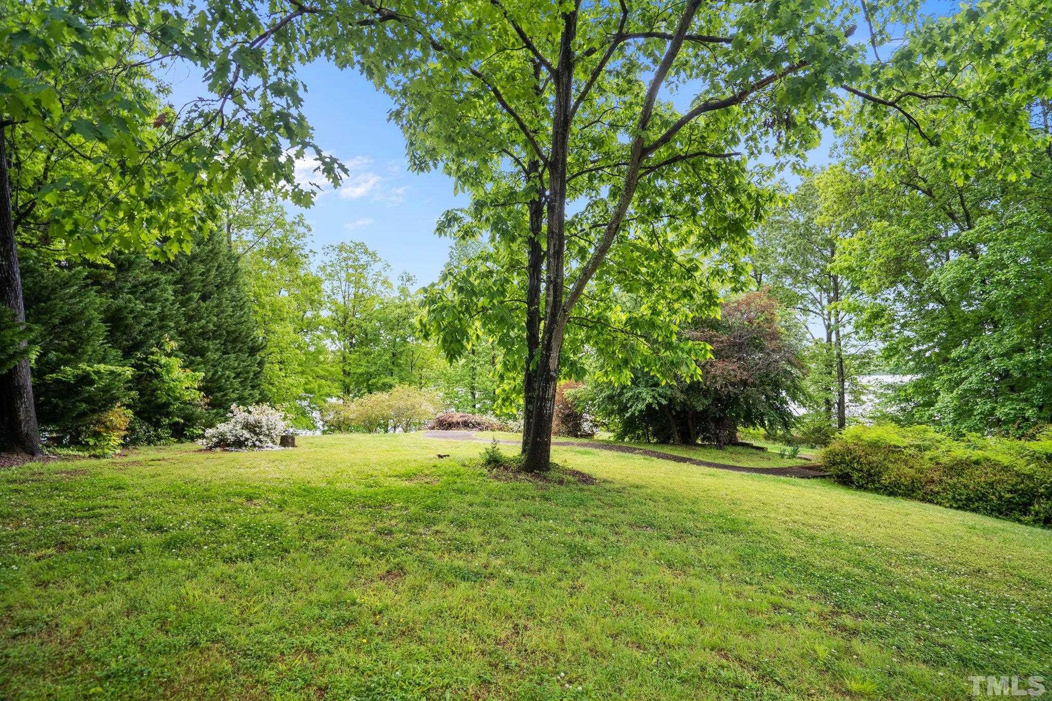 268 Dean Lane Roxboro, NC 27574 - Photo 8 of 38 a view of outdoor space with deck and yard