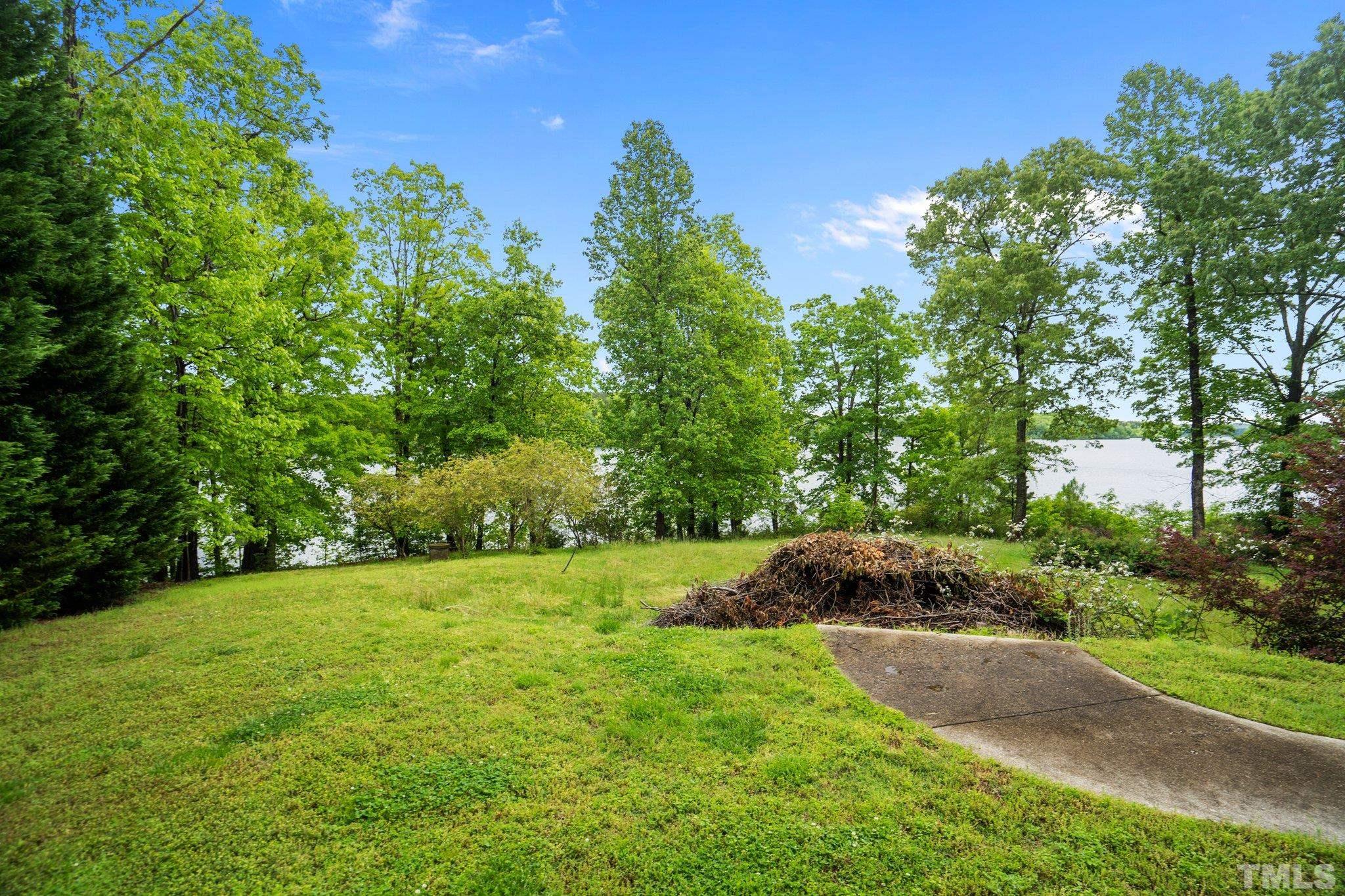 268 Dean Lane Roxboro, NC 27574 - Photo 10 of 38 a backyard of a house with lots of green space
