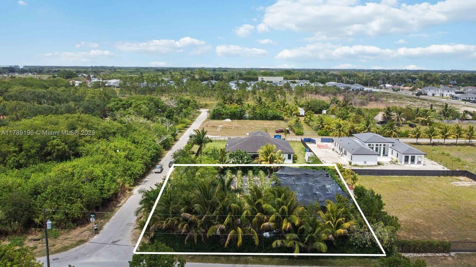 19785 Southwest 326th Street Homestead, FL 33030 - Photo 2 of 5 a view of a city