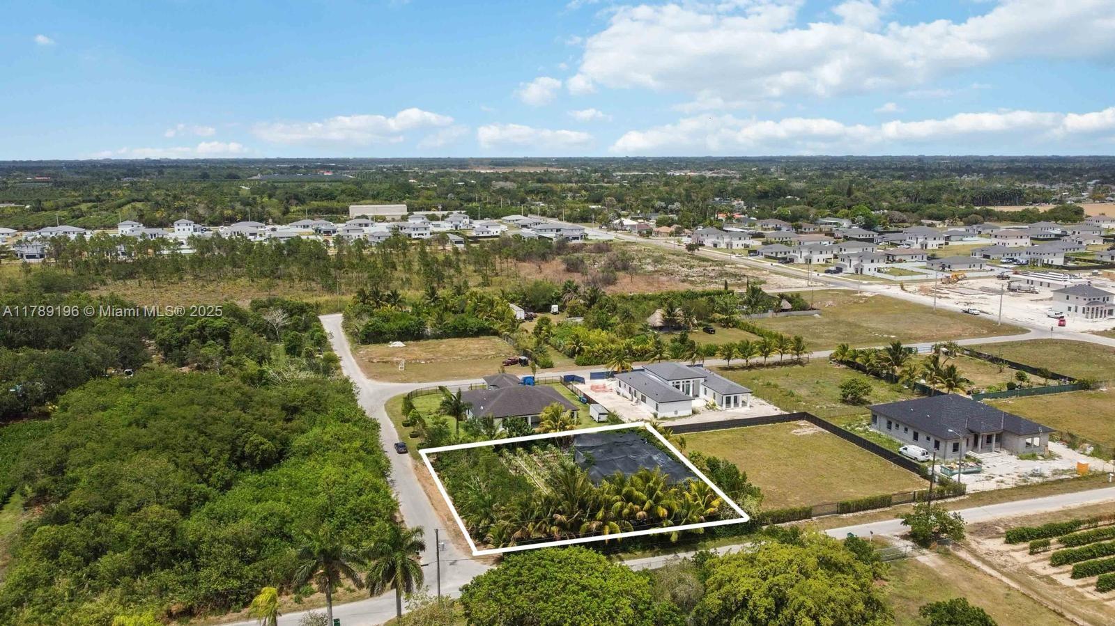 19785 Southwest 326th Street Homestead, FL 33030 - Photo 4 of 5 an aerial view of residential houses with outdoor space
