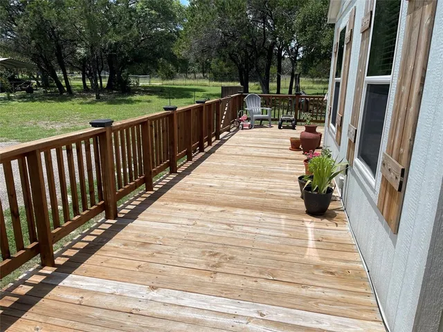 a view of a patio with wooden floor