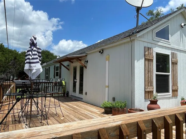 a view of balcony with furniture
