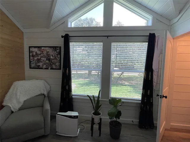 a living room with furniture and a window