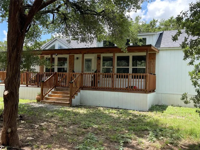 an outdoor view of house with trees around
