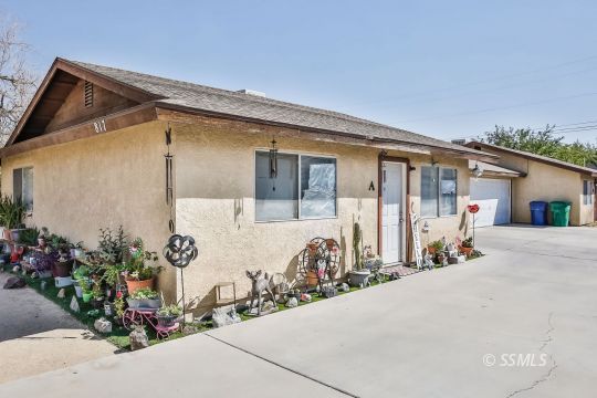 817 Commercial Ridgecrest, CA 93555 - Photo 4 of 6 a front view of a house with a garage