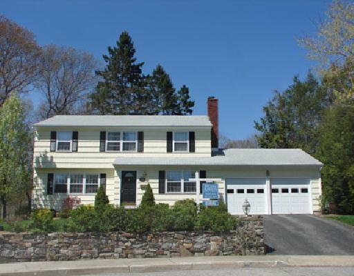 54 Drumm Road Fairfield, CT 06824 - Photo 1 of 1 a large house with a lot of plants in front of it