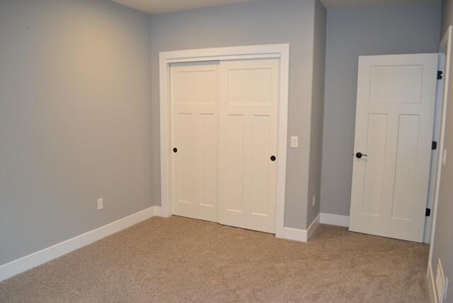 W7986 County Rd B, Unit 13 Lake Mills, WI 53551 - Photo 23 of 32 LM lower bedroom