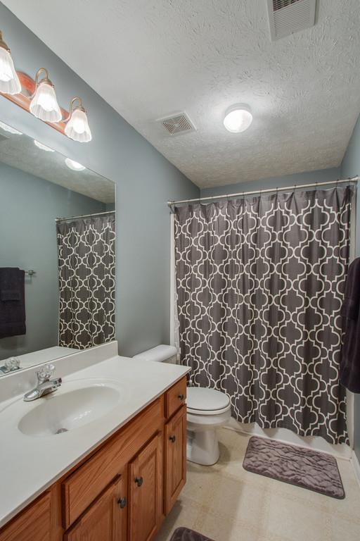 86 Big Springs Road Lebanon, TN 37087 - Photo 24 of 27 a bathroom with a sink toilet and shower