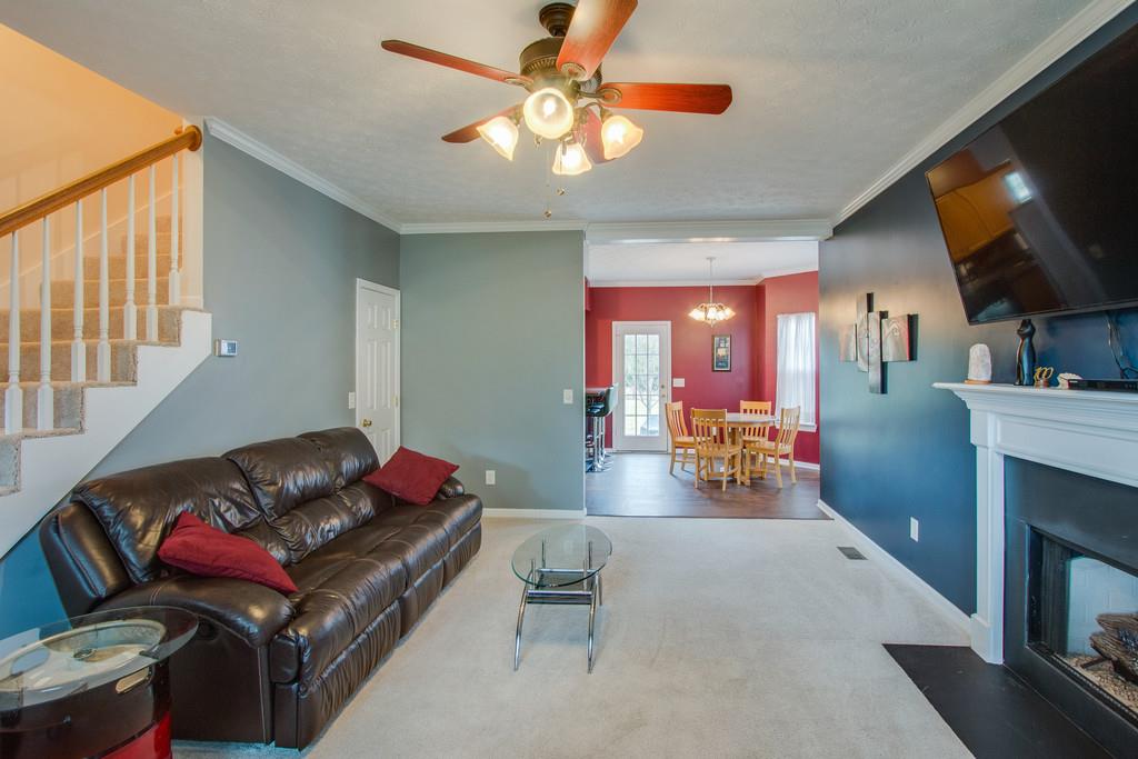 86 Big Springs Road Lebanon, TN 37087 - Photo 5 of 27 a living room with furniture a flat screen tv and kitchen view