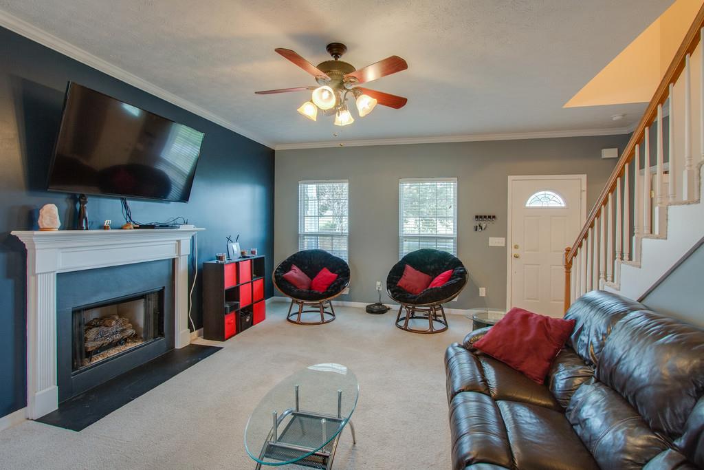86 Big Springs Road Lebanon, TN 37087 - Photo 6 of 27 a living room with furniture a flat screen tv and a fireplace
